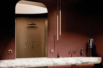 Die einheitlichen Oberfl&auml;chen &ndash; hier zu sehen anhand der Armaturen von Dornbracht und Schalter von Jung &ndash; lassen ein ruhiges Erscheinungsbild entstehen